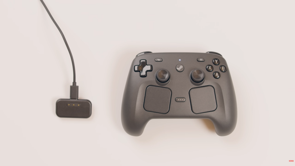 Controller und Empfänger-Puk mit Ladekabel